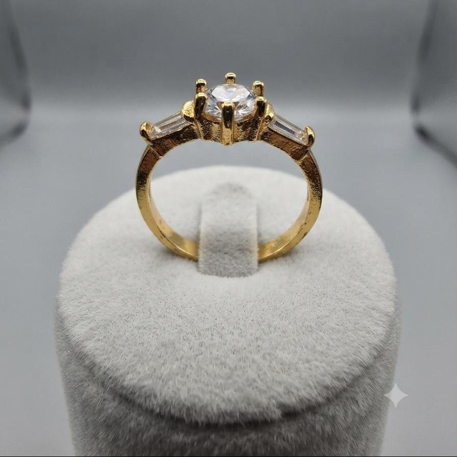 Classic Gold Three-Stone Ring with Round Center and Baguette Accents