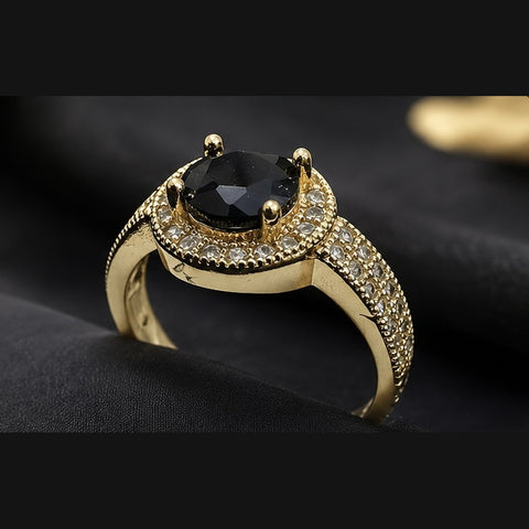 Vintage-Inspired Gold Halo Ring with Round Black Centerpiece